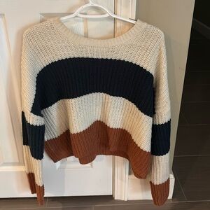 this is a knitted sweater in a size small